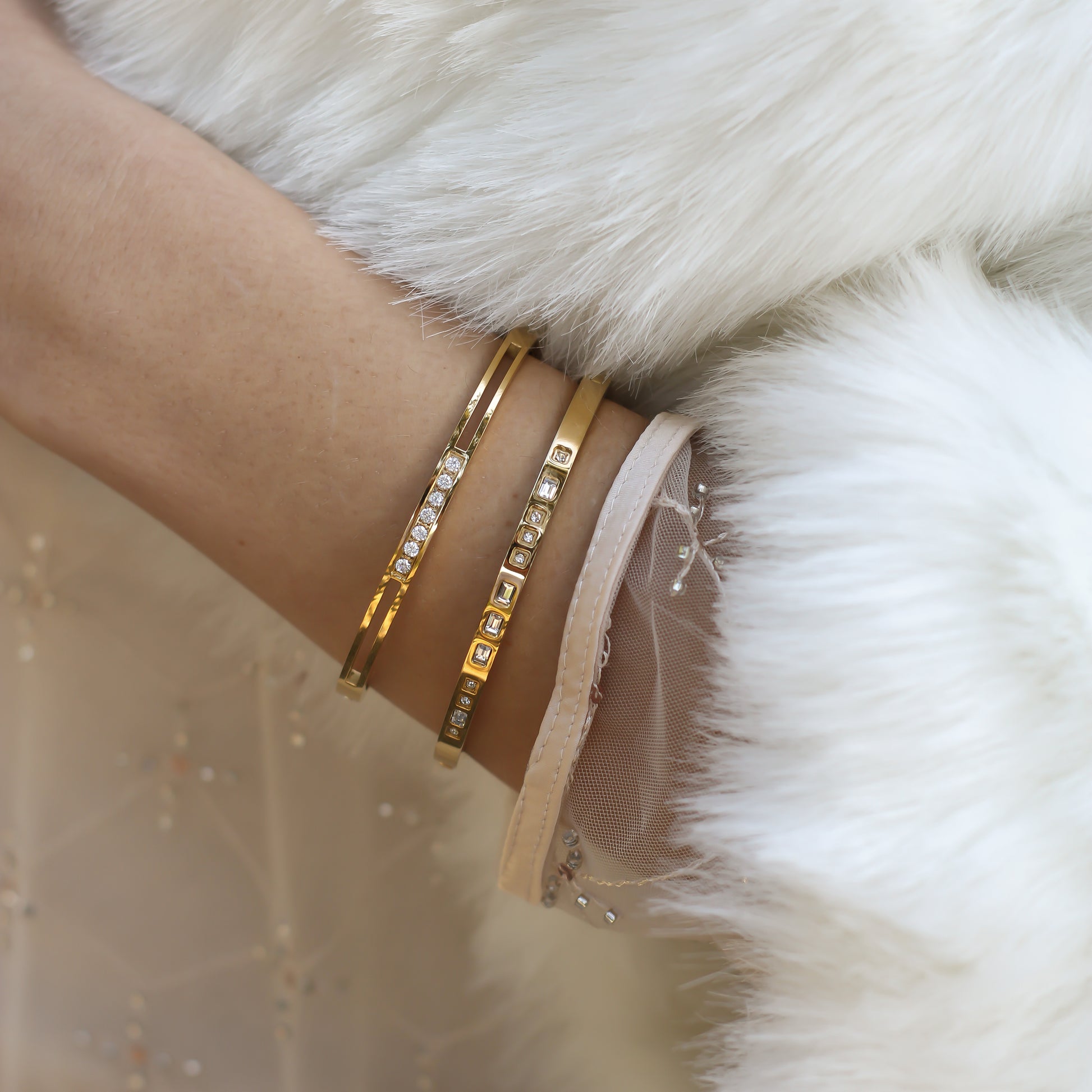 Gold-plated stainless steel bangle with elegant Morse code engraving and stylish design.